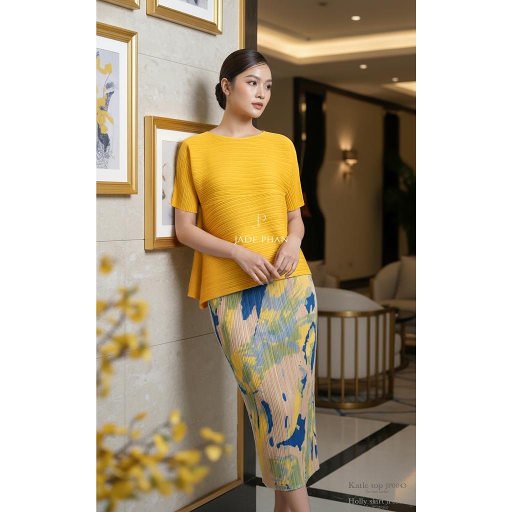 Set gồm áo và chân váyxếp ly Áo katle vàng và chân váy Holly mảng màu cam vàng xanh dập ly [+]