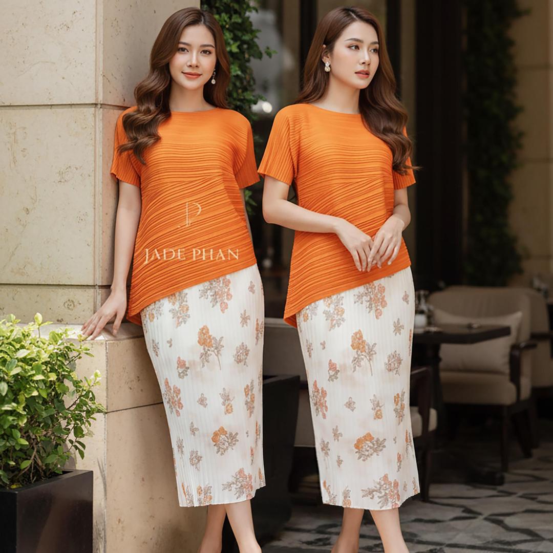 Set gồm áo và chân váyxếp ly Áo katle cam và chân váy Holly họa tiết hoa cam dập ly [+] — ảnh 1